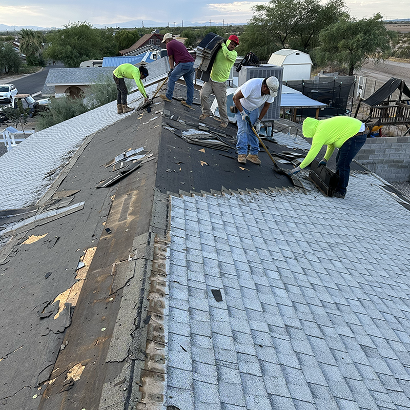 workers on roof repair